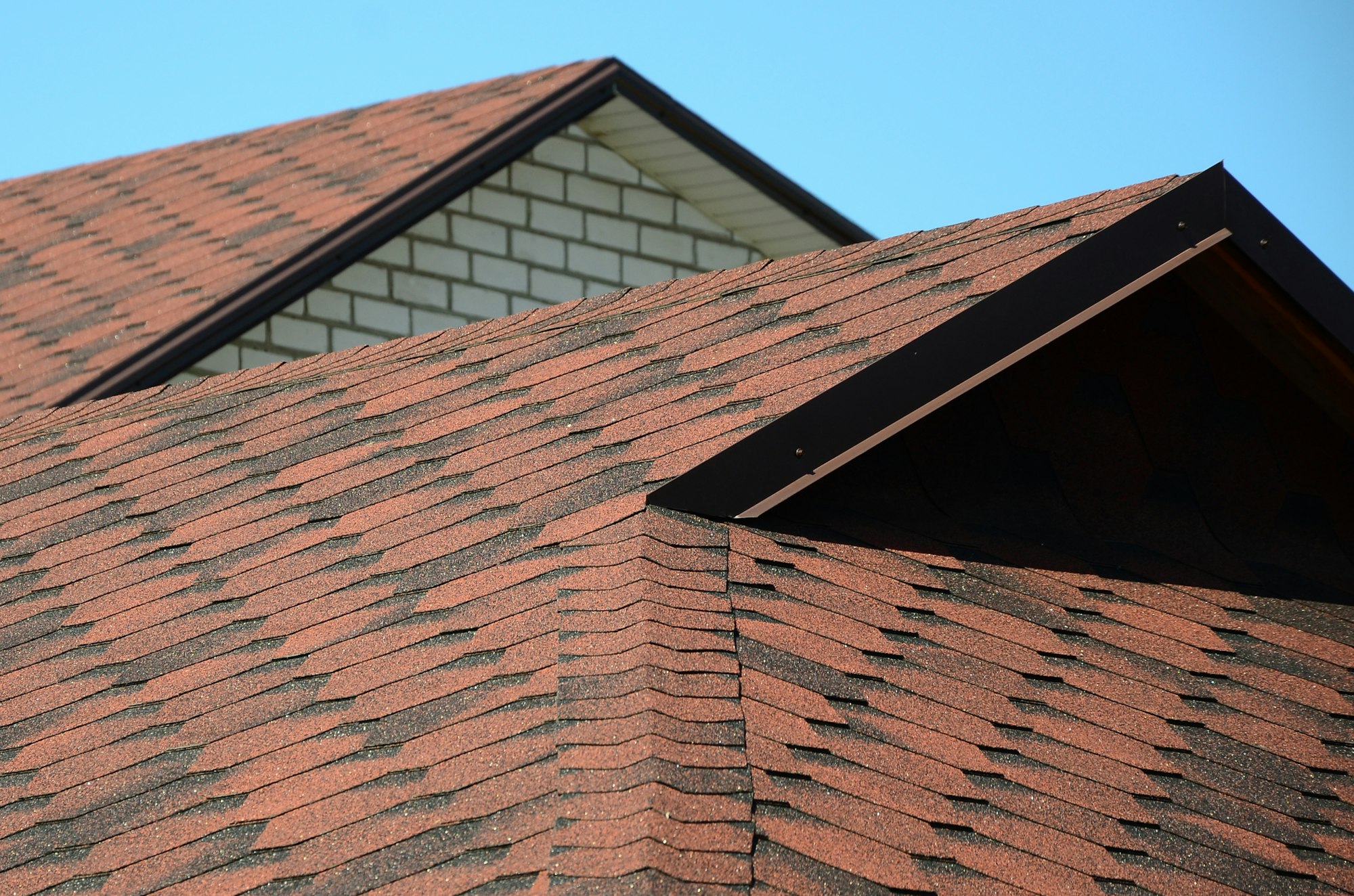 The roof is covered with bituminous shingles of brown color. Quality Roofing